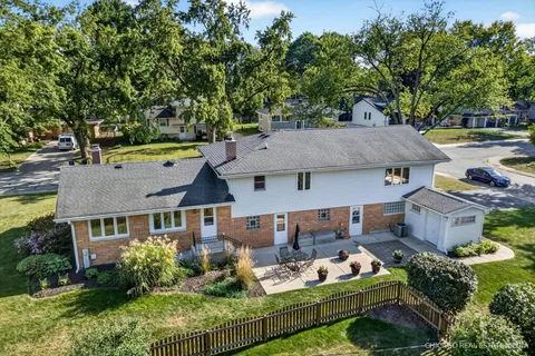 an aerial view of a house with a lake view