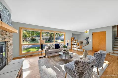 a dining room with furniture and window