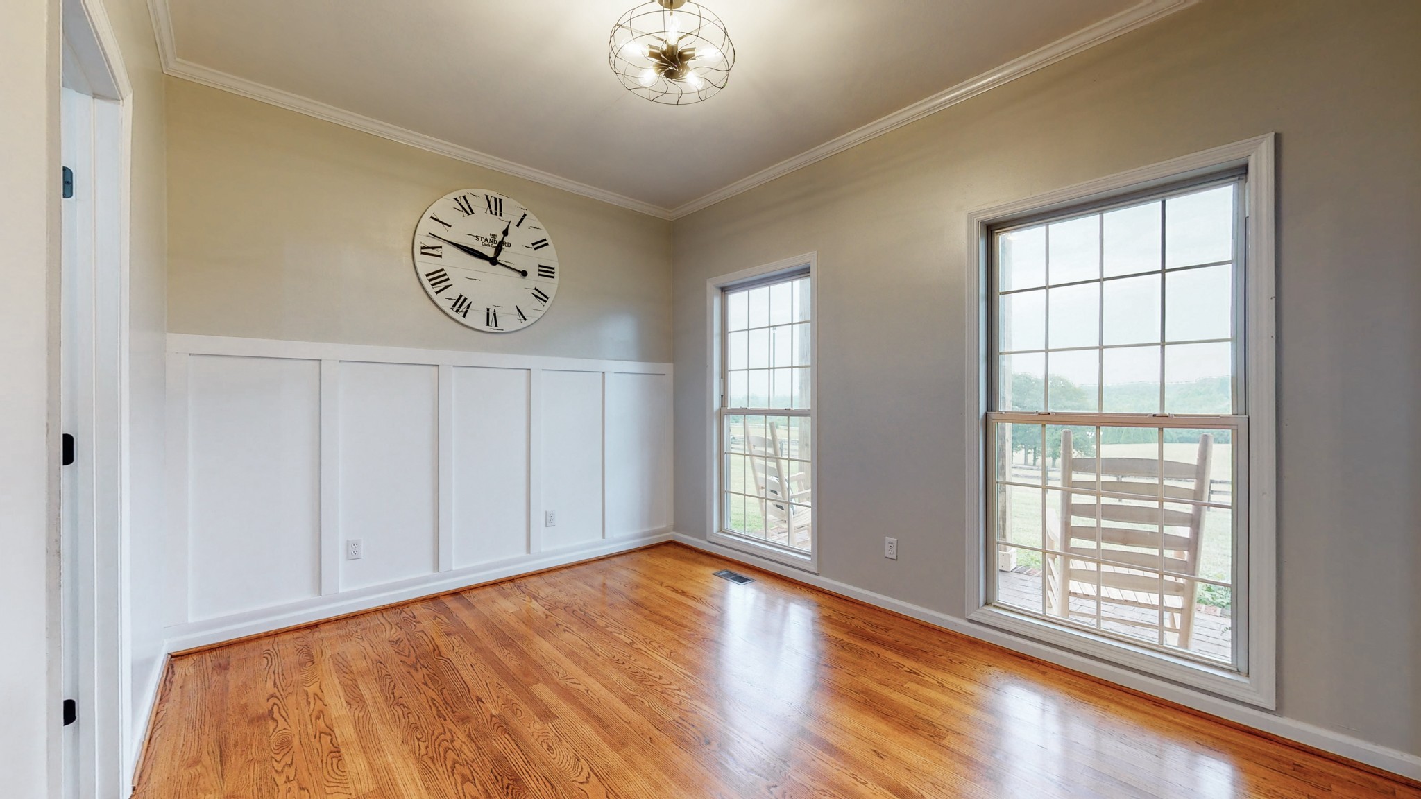 885 Southerland Road Dickson, TN 37055 - Photo 11 of 40 a view of an empty room with a window and wooden floor