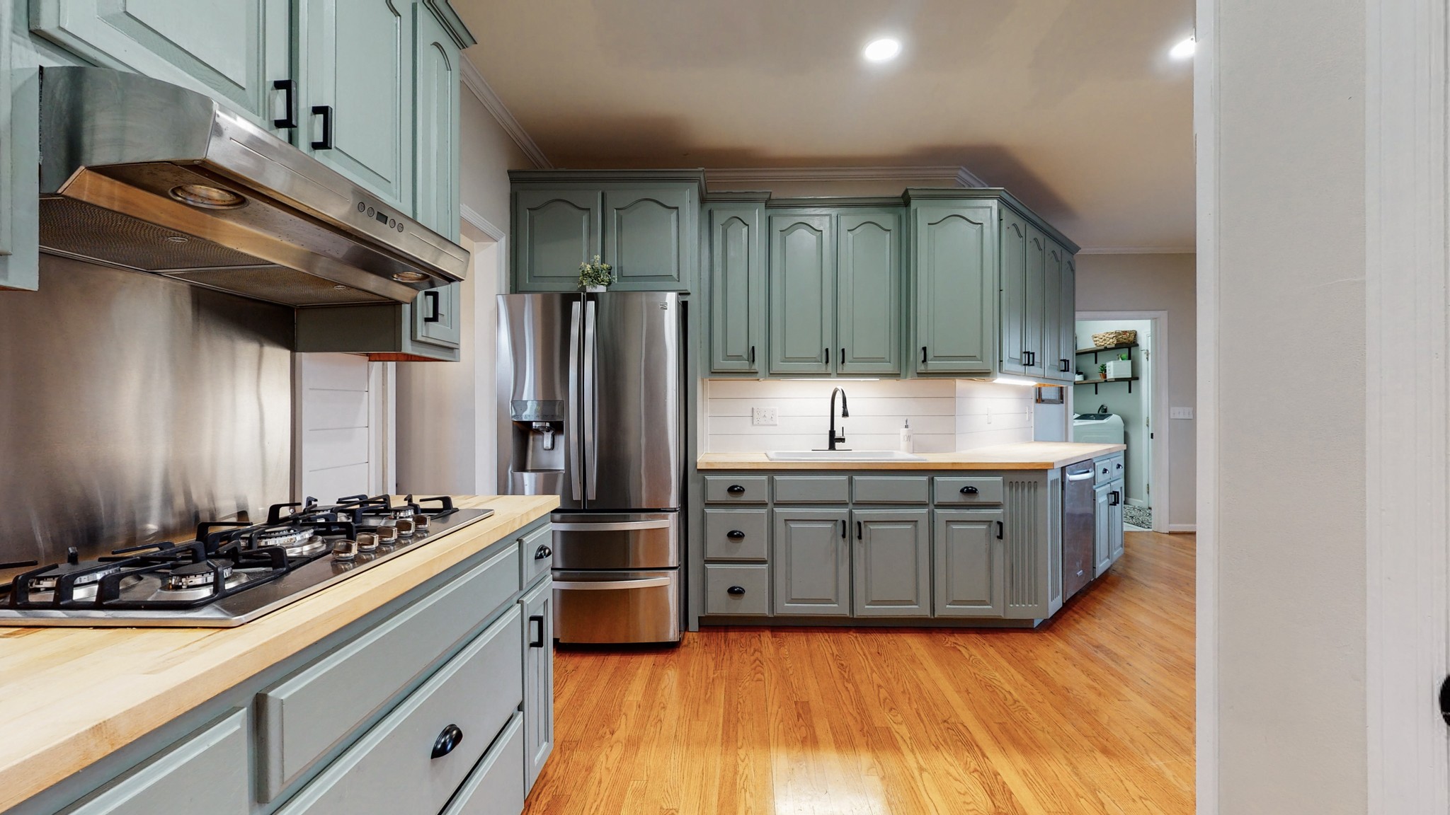 885 Southerland Road Dickson, TN 37055 - Photo 15 of 40 a kitchen with kitchen island granite countertop a sink cabinets and stainless steel appliances