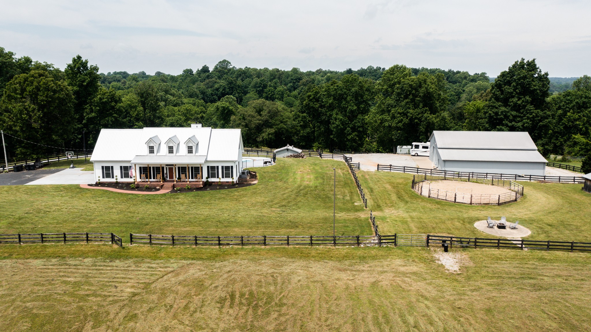885 Southerland Road Dickson, TN 37055 - Photo 3 of 40 a view of a swimming pool with seating area and trees in the background