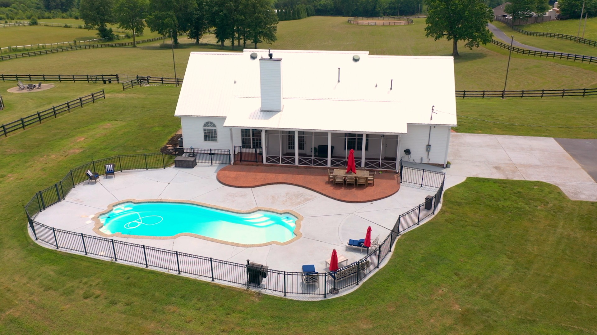 885 Southerland Road Dickson, TN 37055 - Photo 5 of 40 an aerial view of a house with outdoor space pool patio and lake view