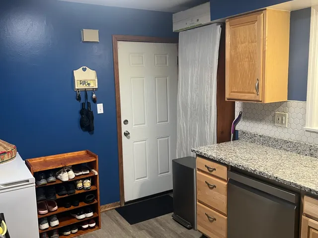 a view of bathroom with a sink and mirror