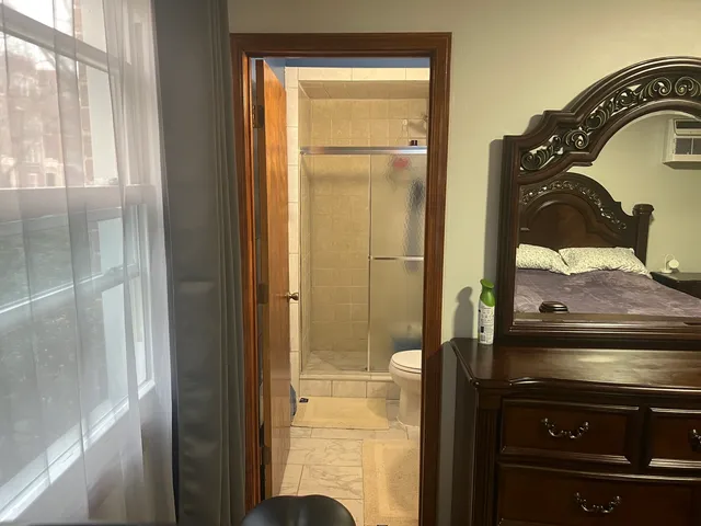 a bathroom with a light fixture and a vanity
