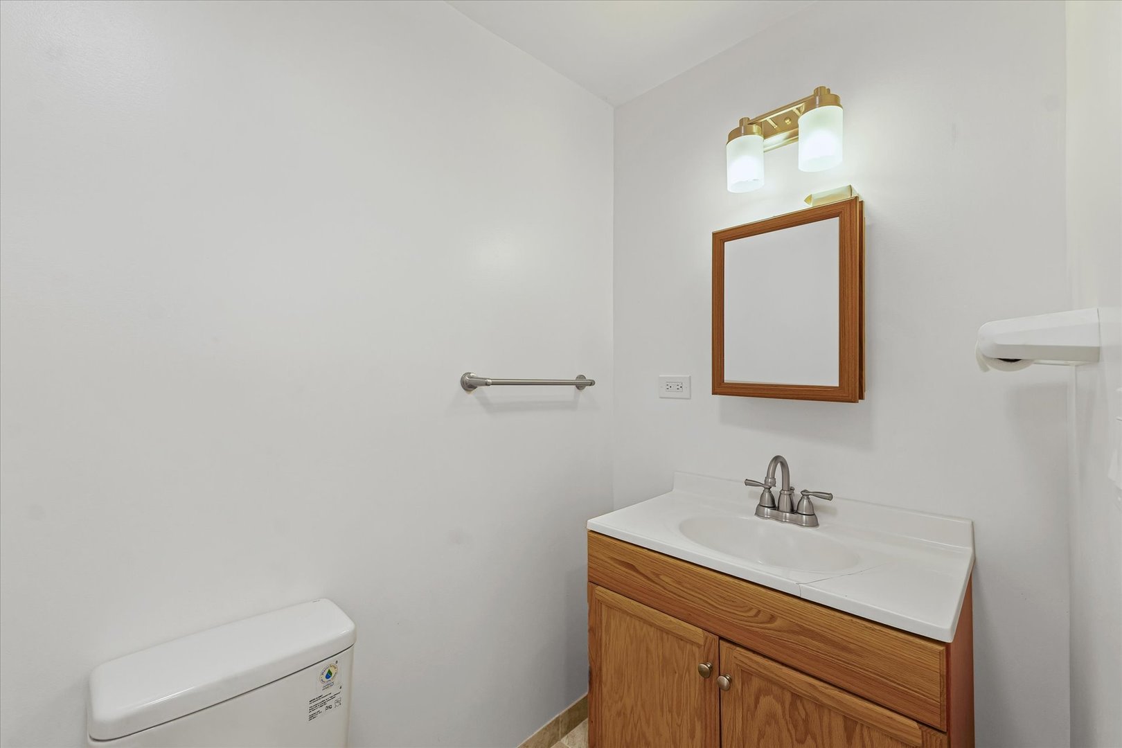 1507 North Ridgeway Avenue Champaign, IL 61821 - Photo 17 of 47 a bathroom with a toilet sink vanity and mirror