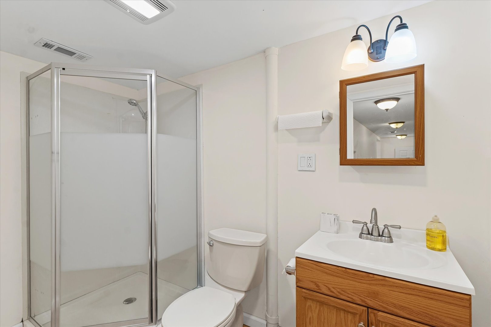 1507 North Ridgeway Avenue Champaign, IL 61821 - Photo 20 of 47 a bathroom with a granite countertop sink a toilet and a mirror