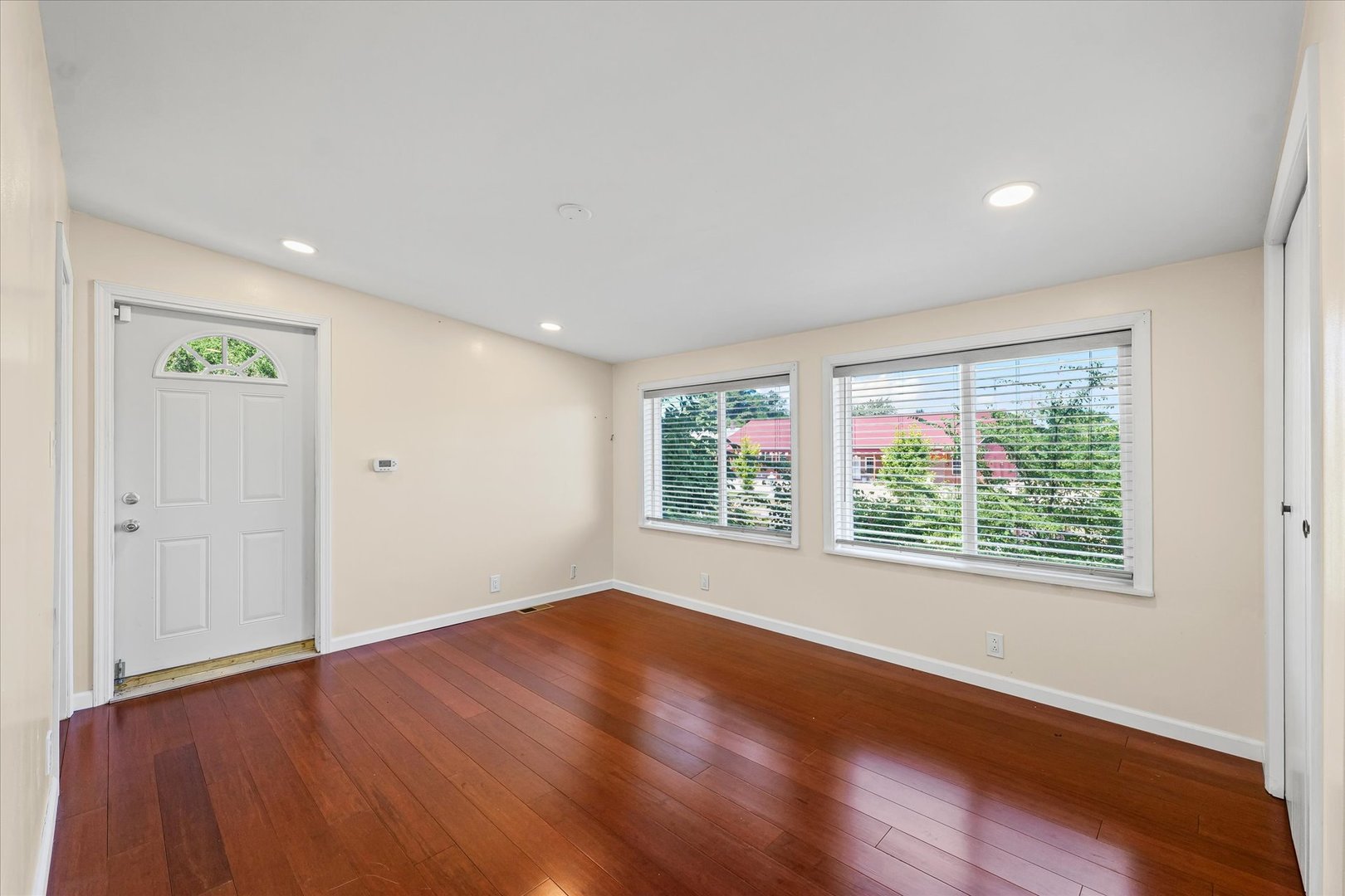1507 North Ridgeway Avenue Champaign, IL 61821 - Photo 25 of 47 a view of an empty room with wooden floor and a window