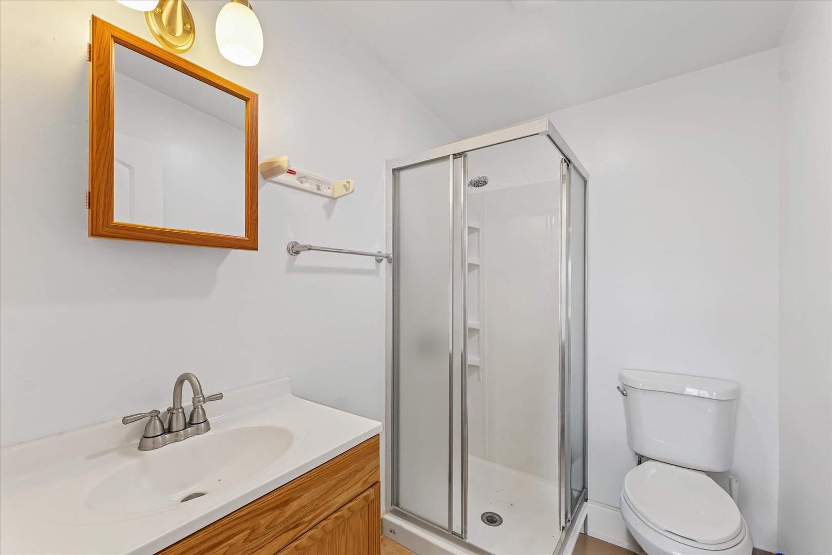 1507 North Ridgeway Avenue Champaign, IL 61821 - Photo 27 of 47 a bathroom with a sink mirror vanity and toilet