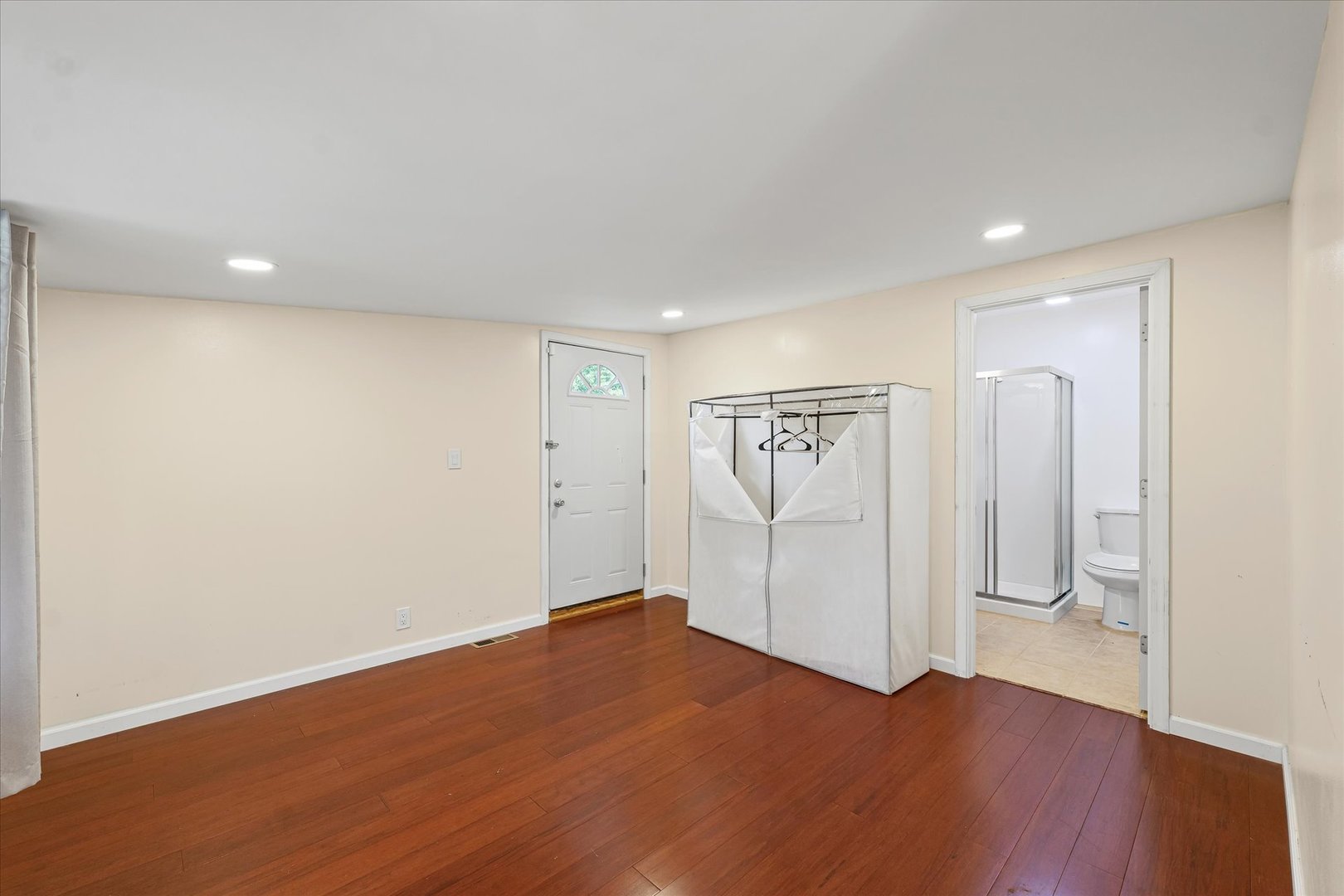 1507 North Ridgeway Avenue Champaign, IL 61821 - Photo 29 of 47 an empty room with wooden floor and bathroom
