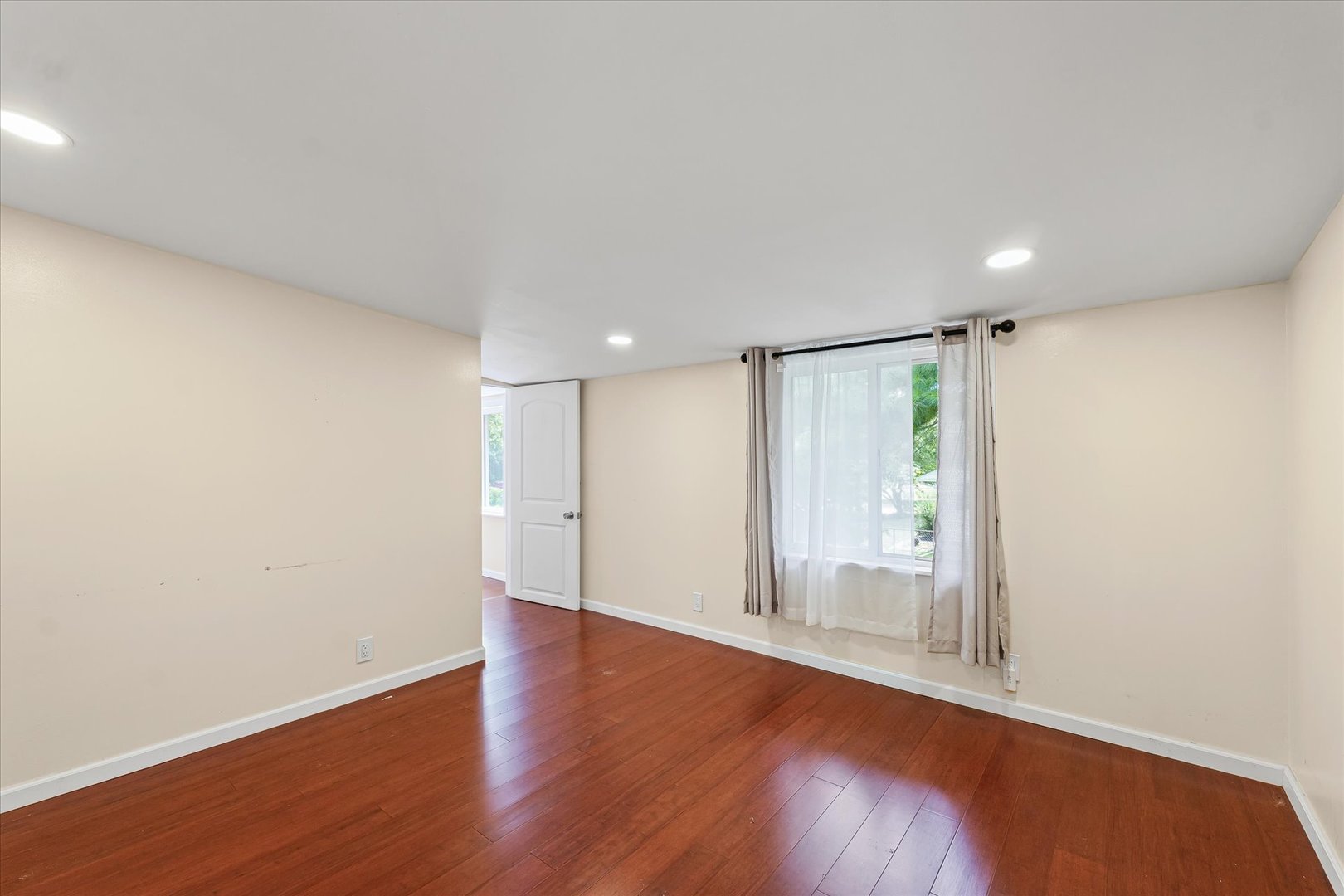 1507 North Ridgeway Avenue Champaign, IL 61821 - Photo 30 of 47 a view of an empty room with wooden floor and a window