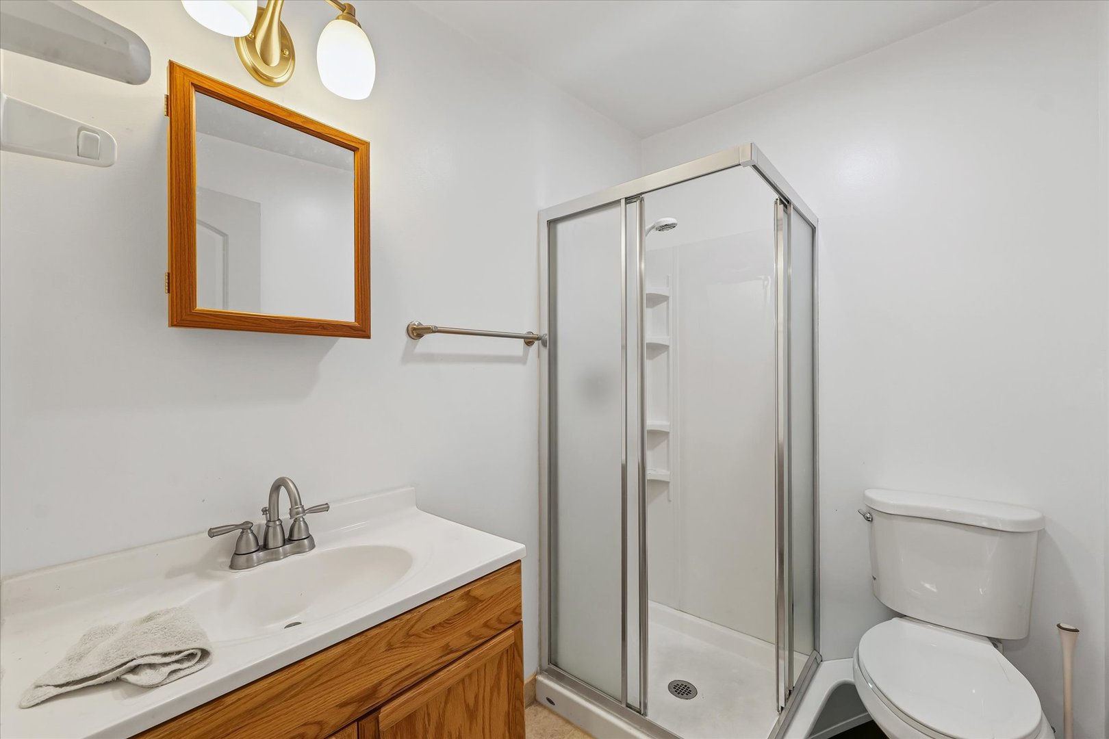 1507 North Ridgeway Avenue Champaign, IL 61821 - Photo 31 of 47 a bathroom with a sink mirror vanity and toilet