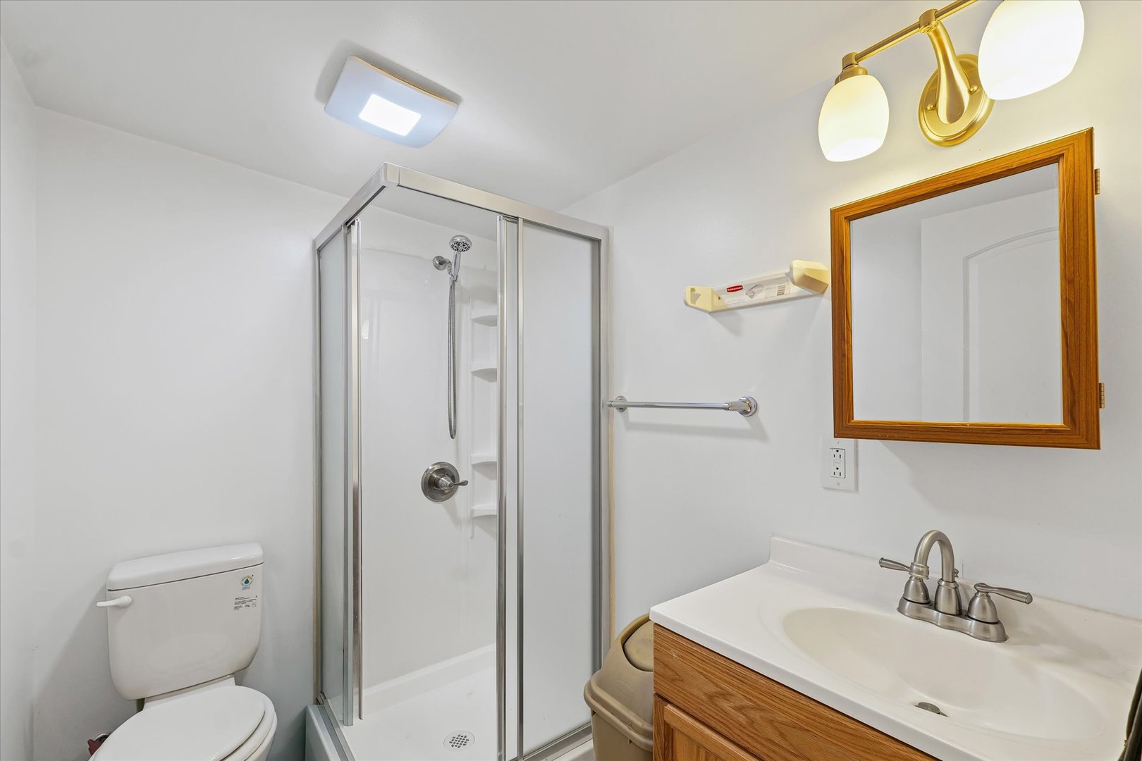 1507 North Ridgeway Avenue Champaign, IL 61821 - Photo 32 of 47 a bathroom with a sink a toilet and shower