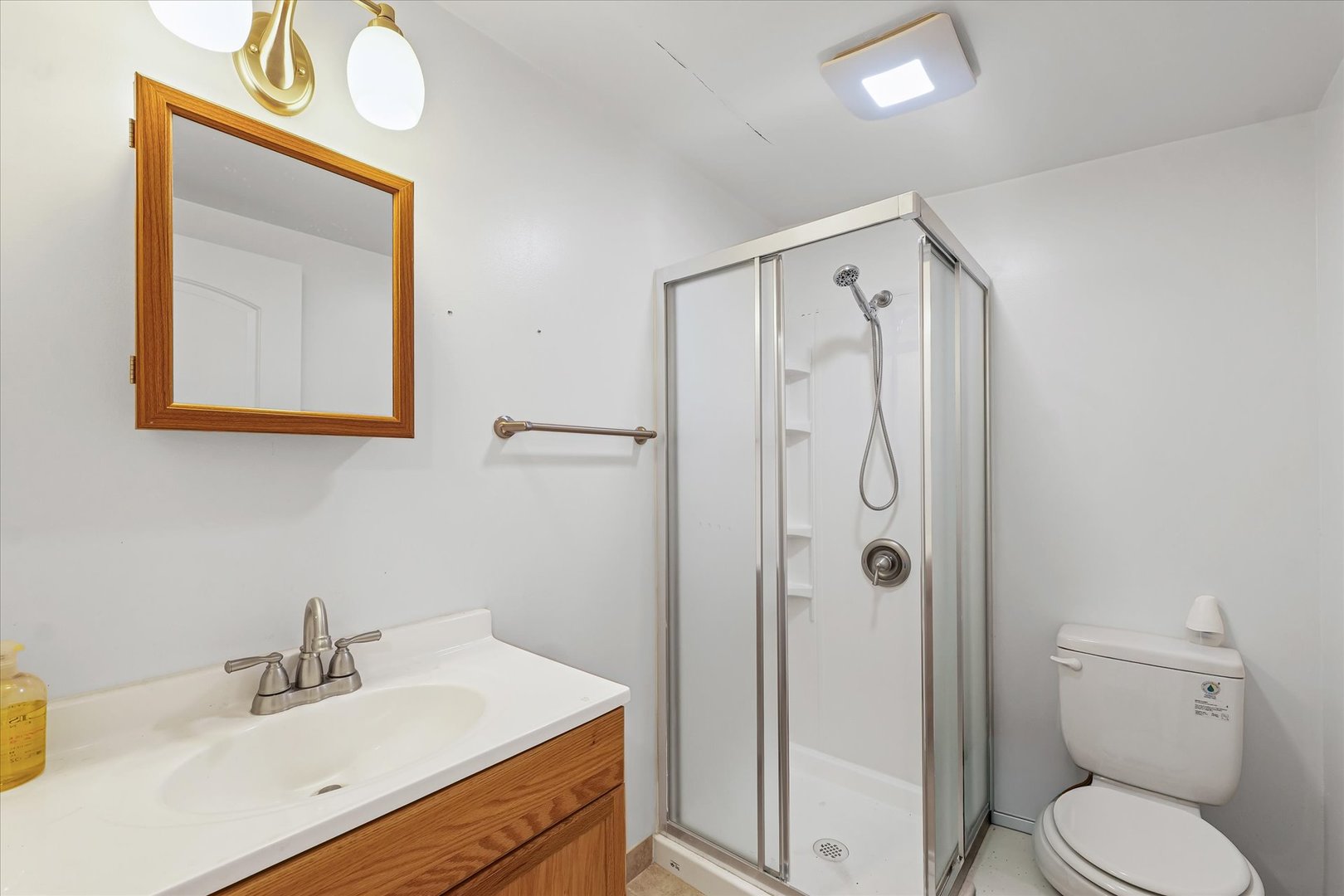 1507 North Ridgeway Avenue Champaign, IL 61821 - Photo 33 of 47 a bathroom with a sink a toilet and shower