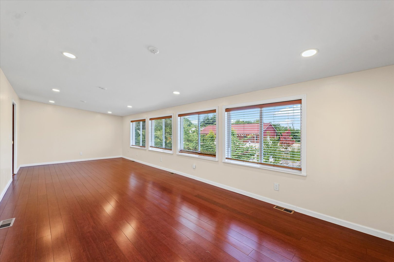 1507 North Ridgeway Avenue Champaign, IL 61821 - Photo 37 of 47 a view of an empty room with wooden floor and a window