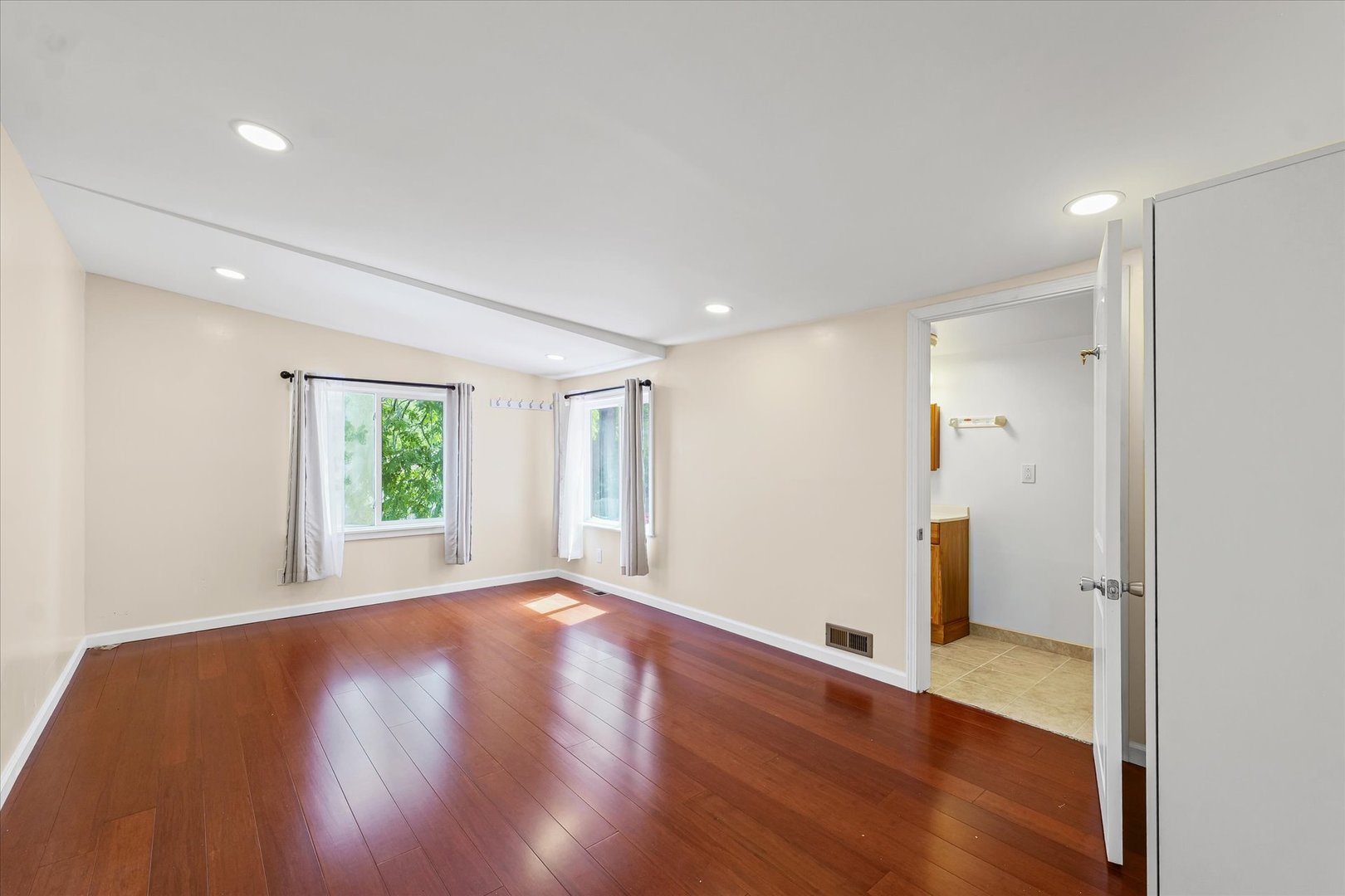 1507 North Ridgeway Avenue Champaign, IL 61821 - Photo 38 of 47 a view of an empty room with wooden floor and a window