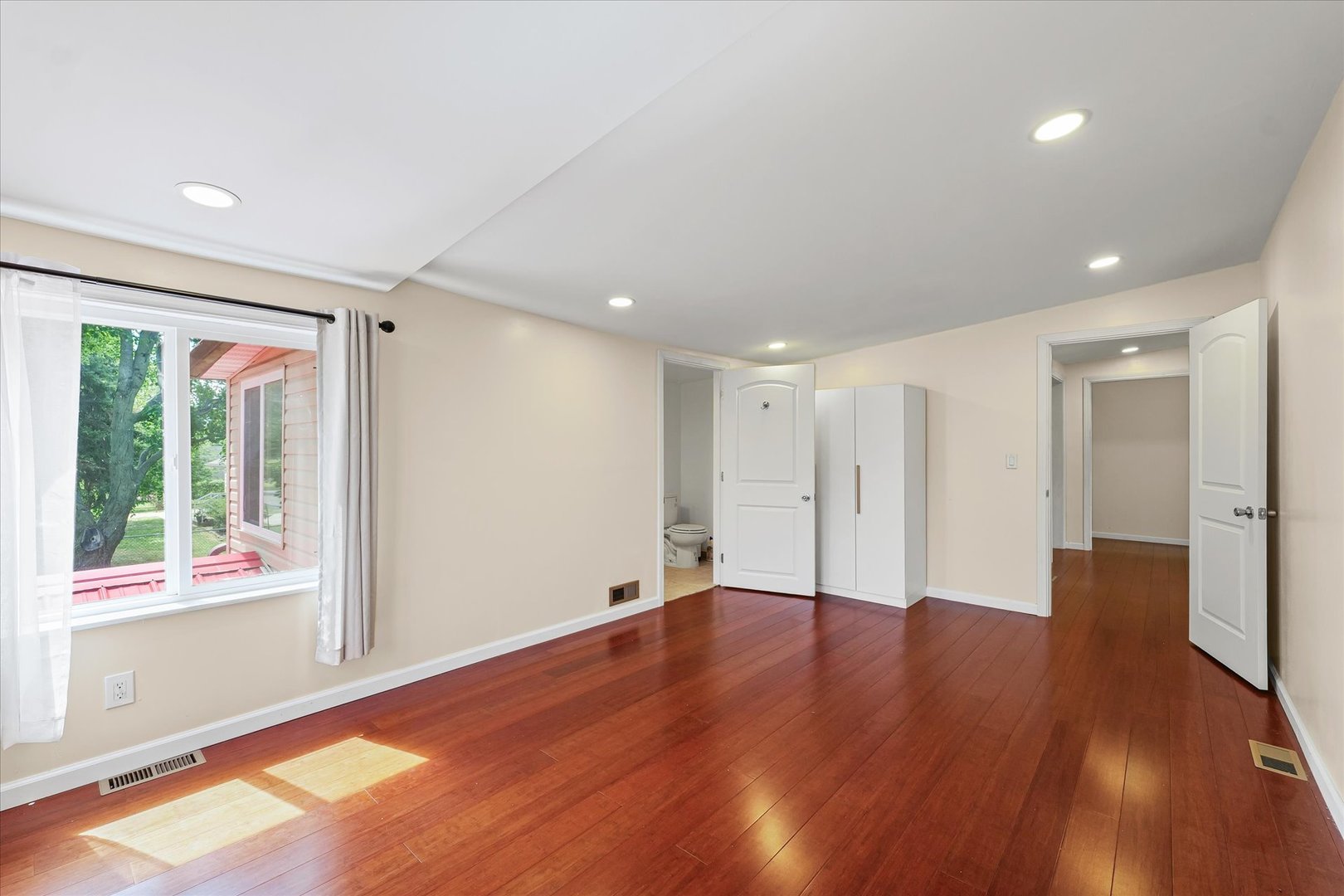 1507 North Ridgeway Avenue Champaign, IL 61821 - Photo 39 of 47 a view of an empty room with wooden floor and a window