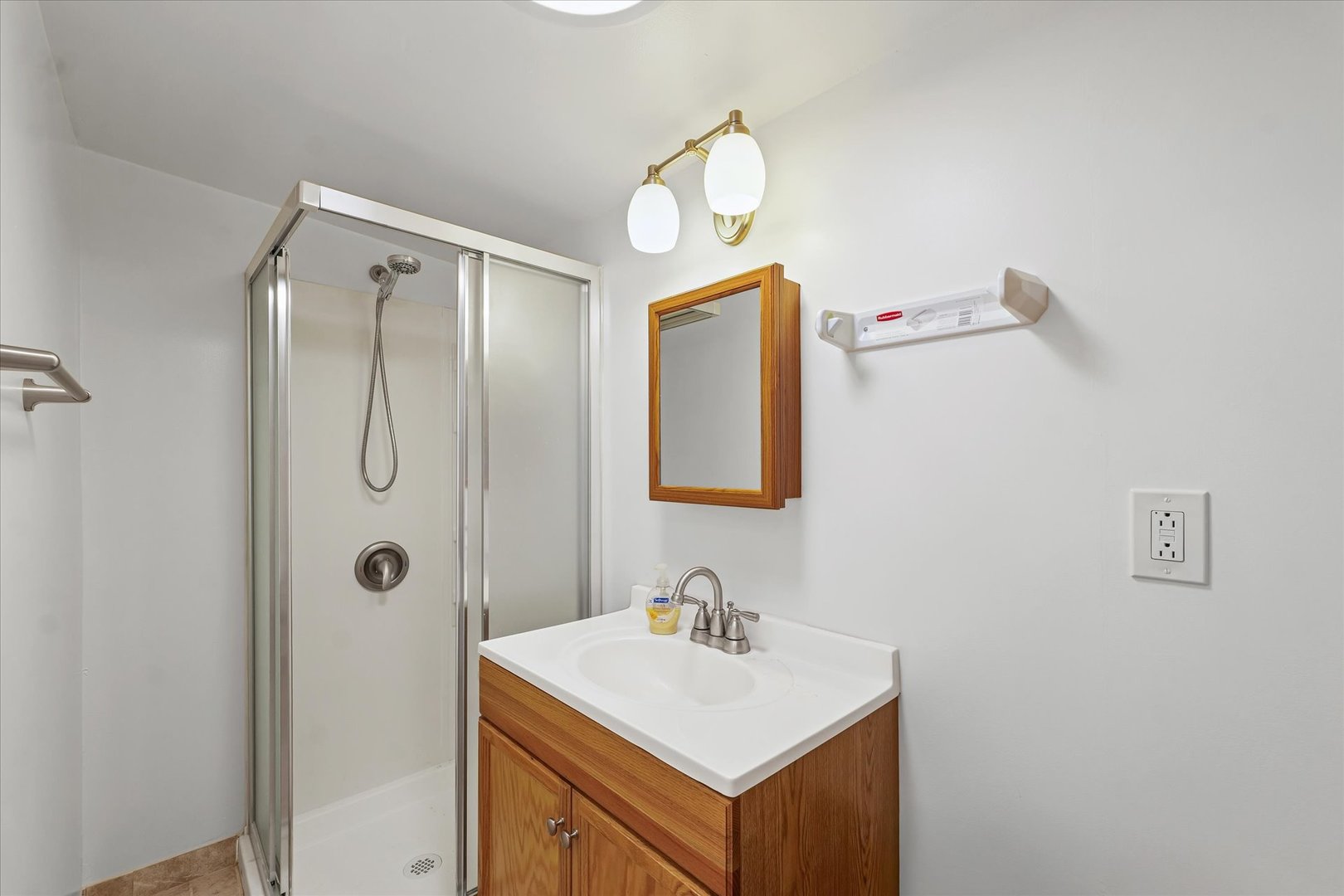 1507 North Ridgeway Avenue Champaign, IL 61821 - Photo 40 of 47 a bathroom with a sink a mirror and a shower