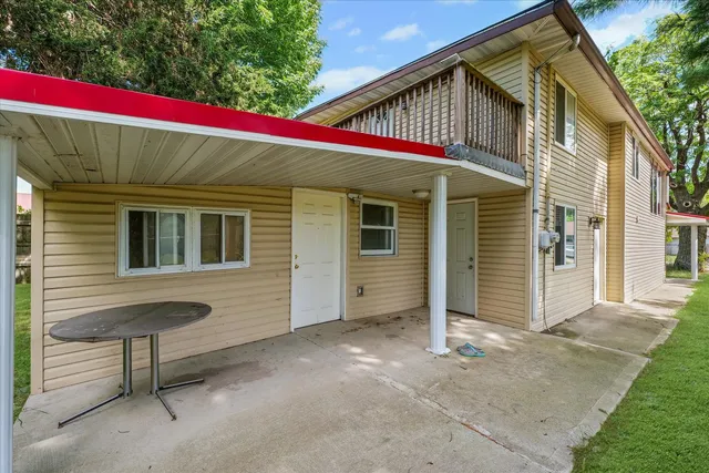 a view of a yard with a house and large trees