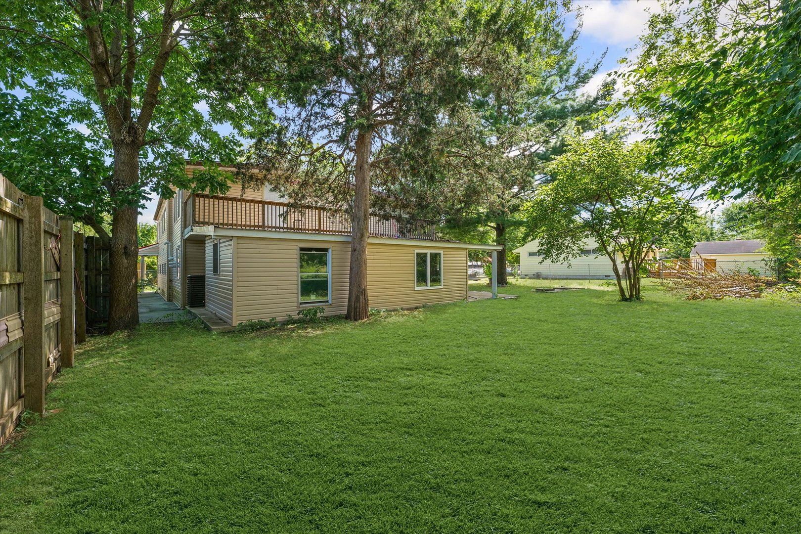 1507 North Ridgeway Avenue Champaign, IL 61821 - Photo 45 of 47 a view of a yard with a house and large trees