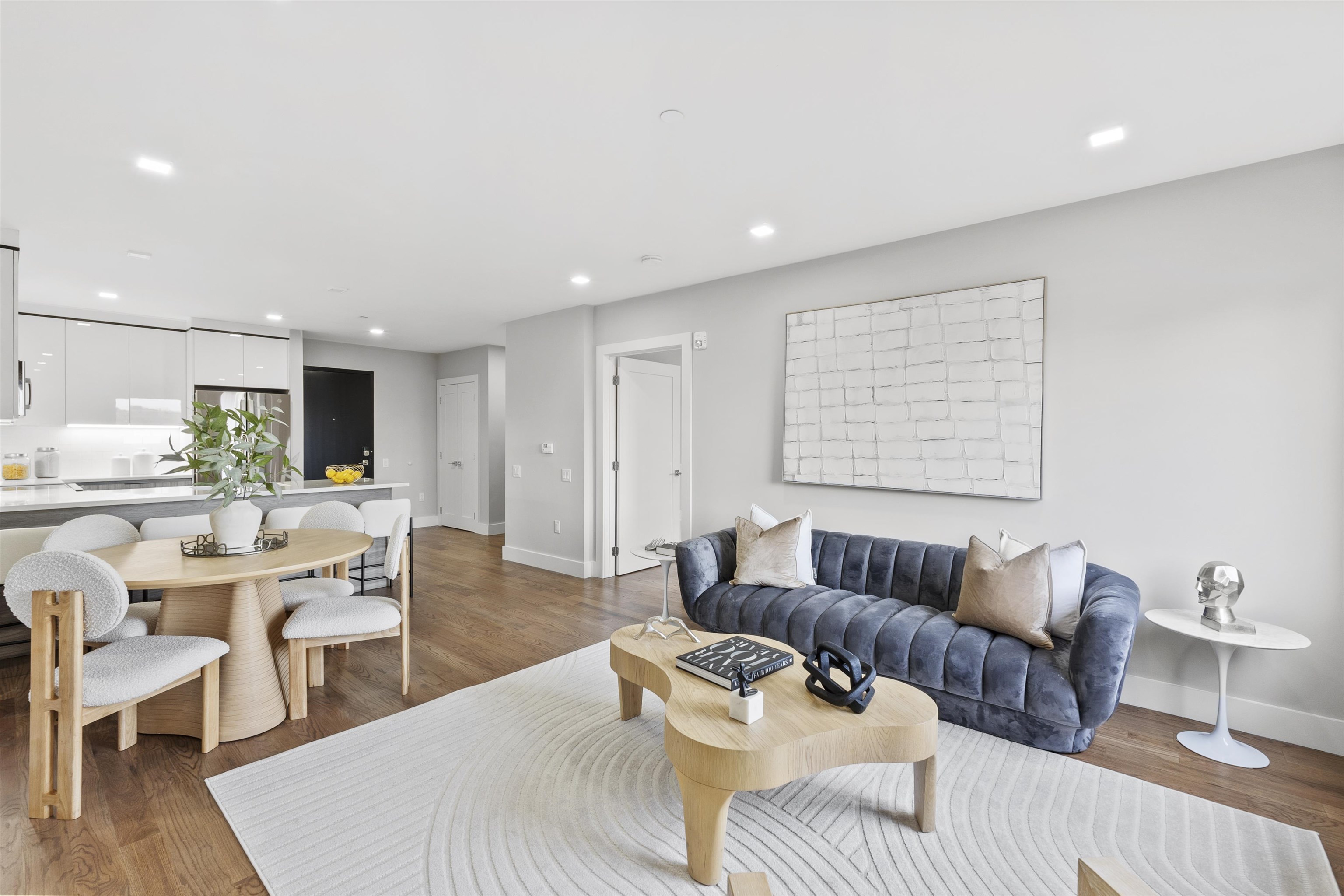 60-64 68th Street, Unit 505 Guttenberg, NJ 07093 - Photo 7 of 24 a living room with furniture and a wooden floor