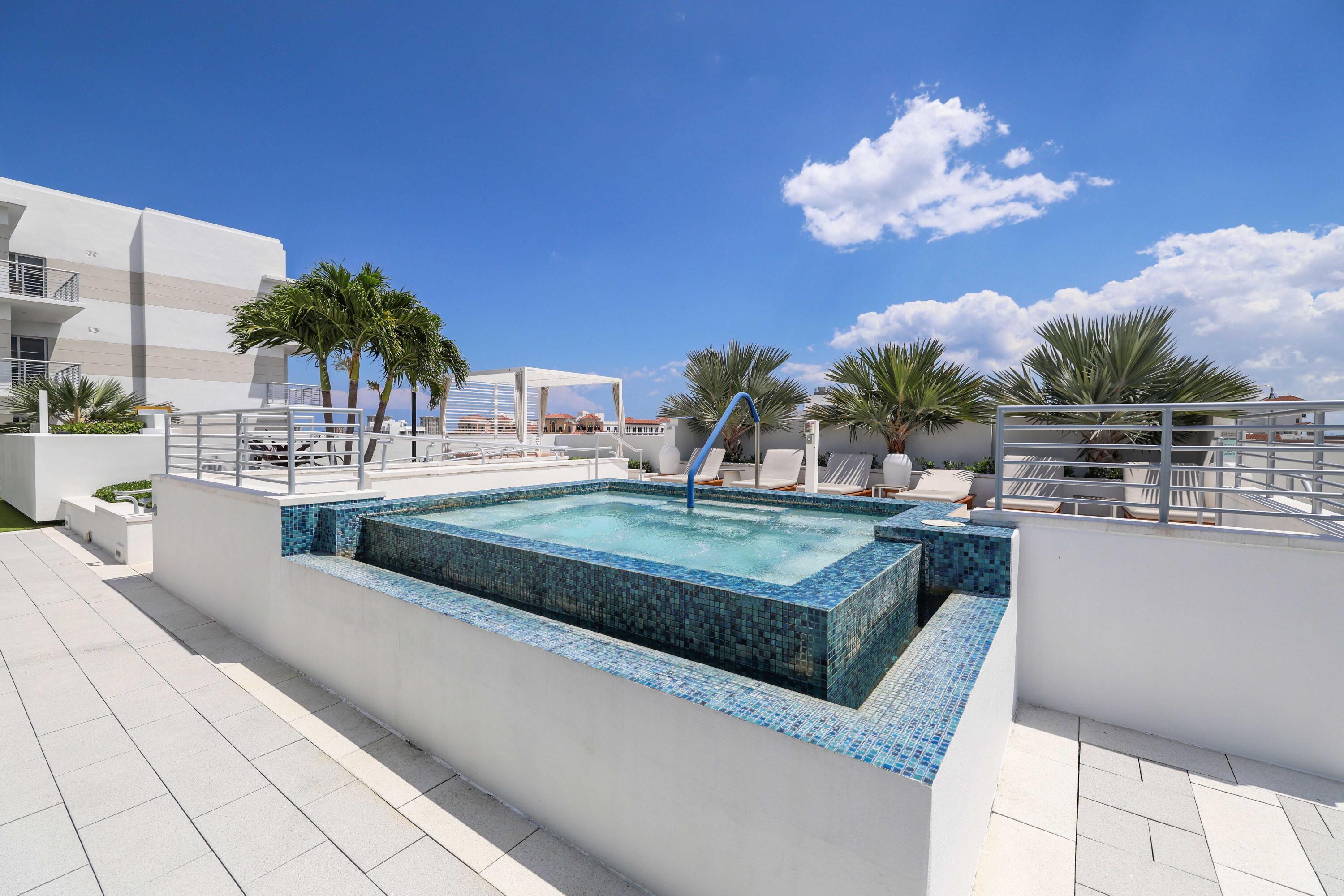 155 East Boca Raton Road, Unit 723 Boca Raton, FL 33432 - Photo 28 of 54 a view of a swimming pool with a patio