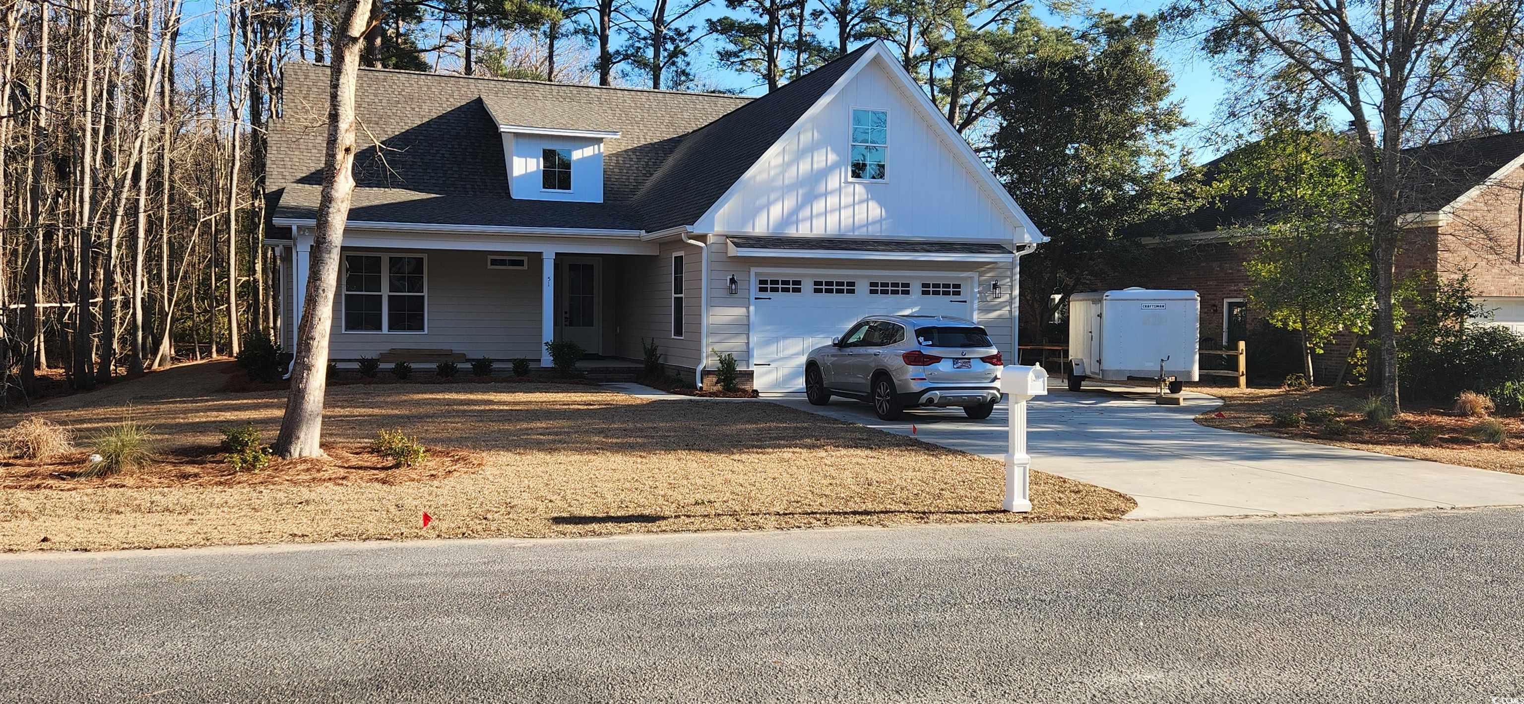 View of front of house with a garage