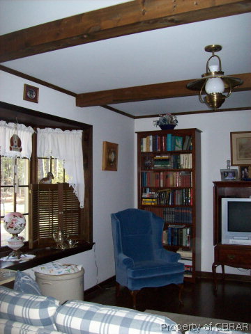2118 Glebe Road Mathews, VA 23109 - Photo 9 of 22 a living room with furniture and a fireplace