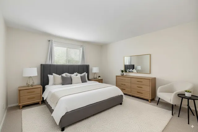 a bedroom with a bed and a desk