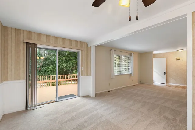 a view of an empty room with glass door