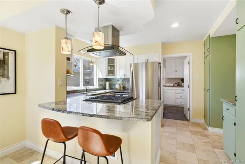 a view of a kitchen and utility room