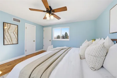 a view of a room with wooden floor and window