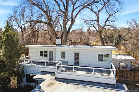 a view of a terrace with chairs and a fire pit