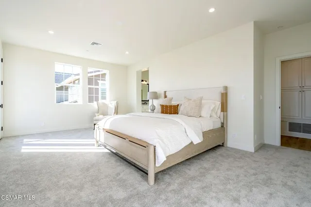 a spacious bathroom with a bathtub and shower