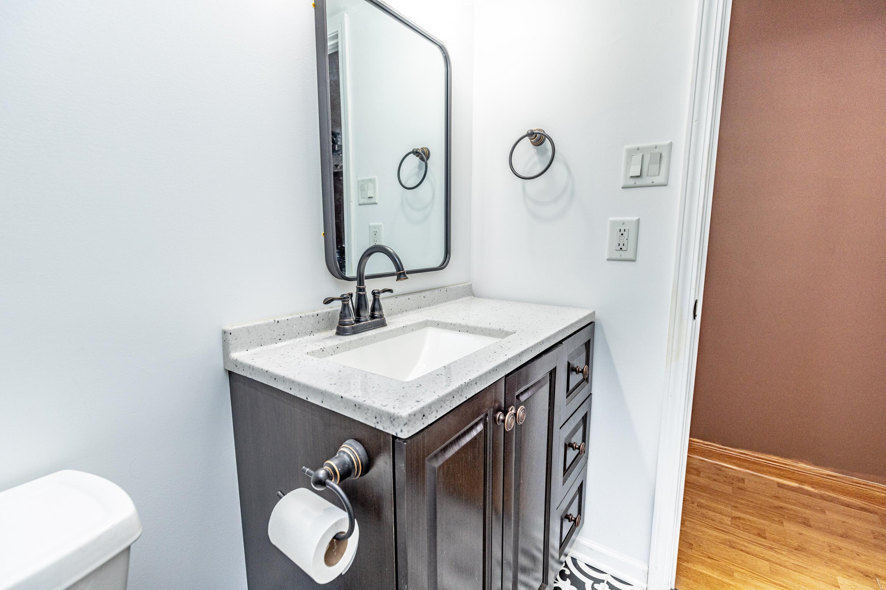 746-1 Acadia Road Valparaiso, IN 46385 - Photo 17 of 44 a bathroom with a sink and a mirror