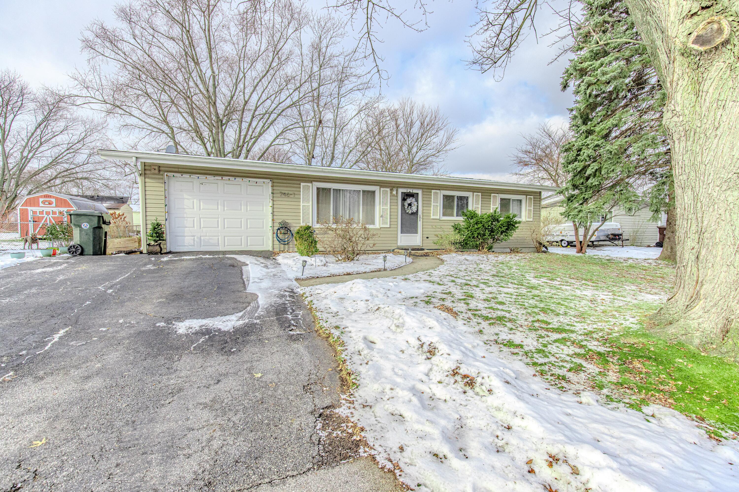 746-1 Acadia Road Valparaiso, IN 46385 - Photo 2 of 44 a view of a house with a yard covered in snow