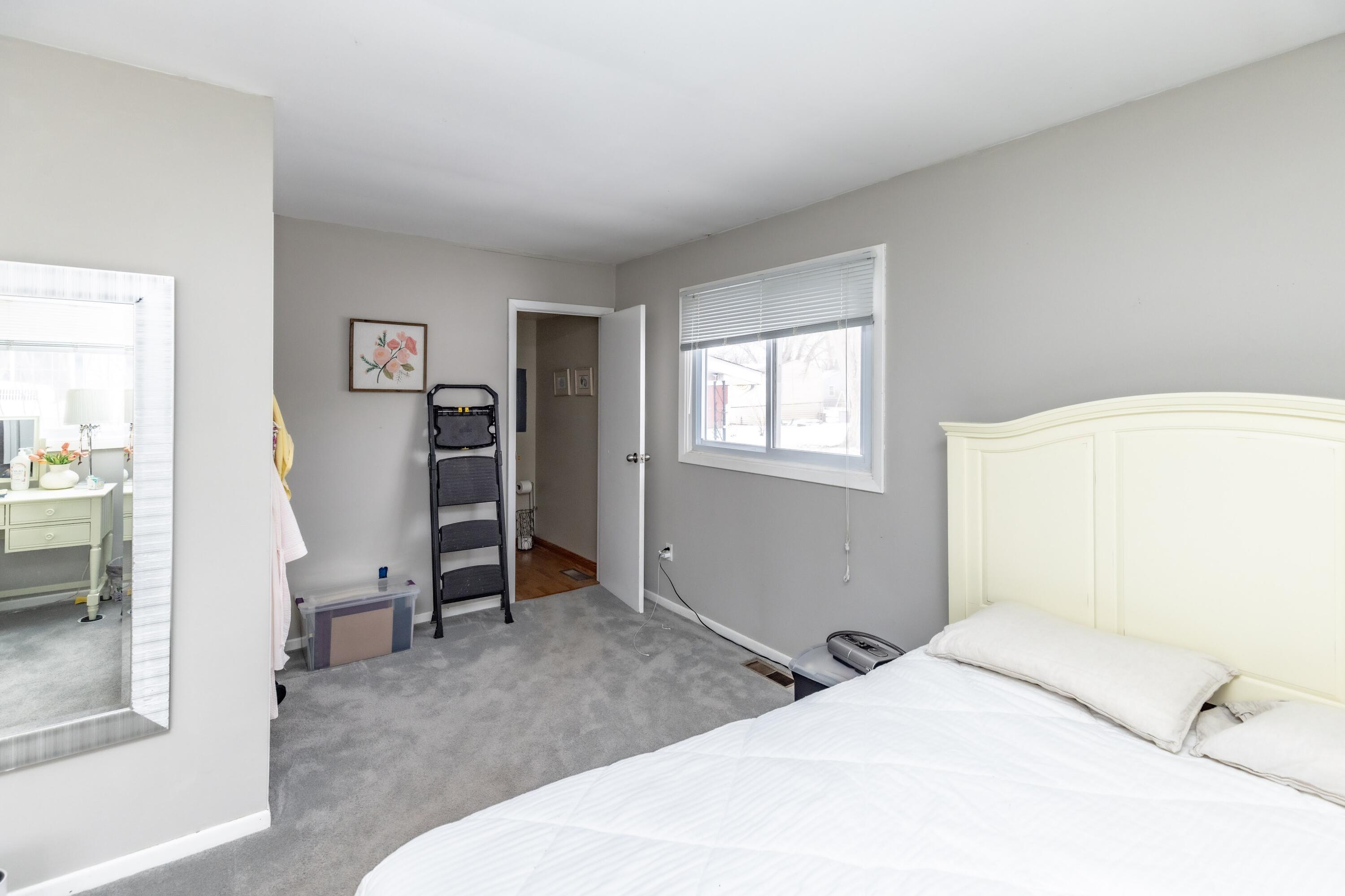 746-1 Acadia Road Valparaiso, IN 46385 - Photo 22 of 44 a bedroom with a bed and a desk