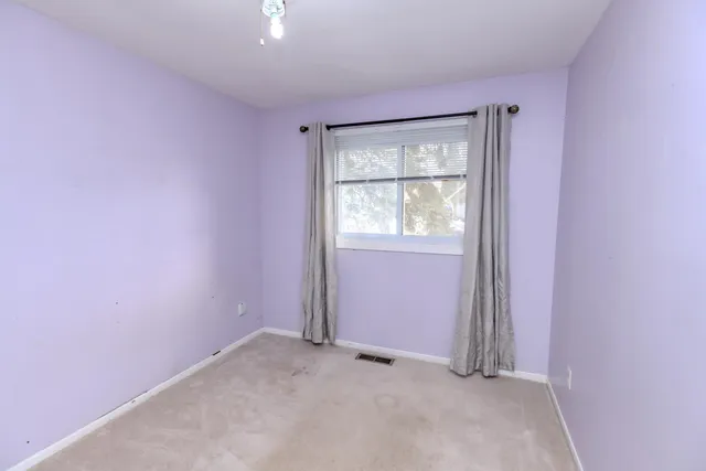 a view of a livingroom with shelves