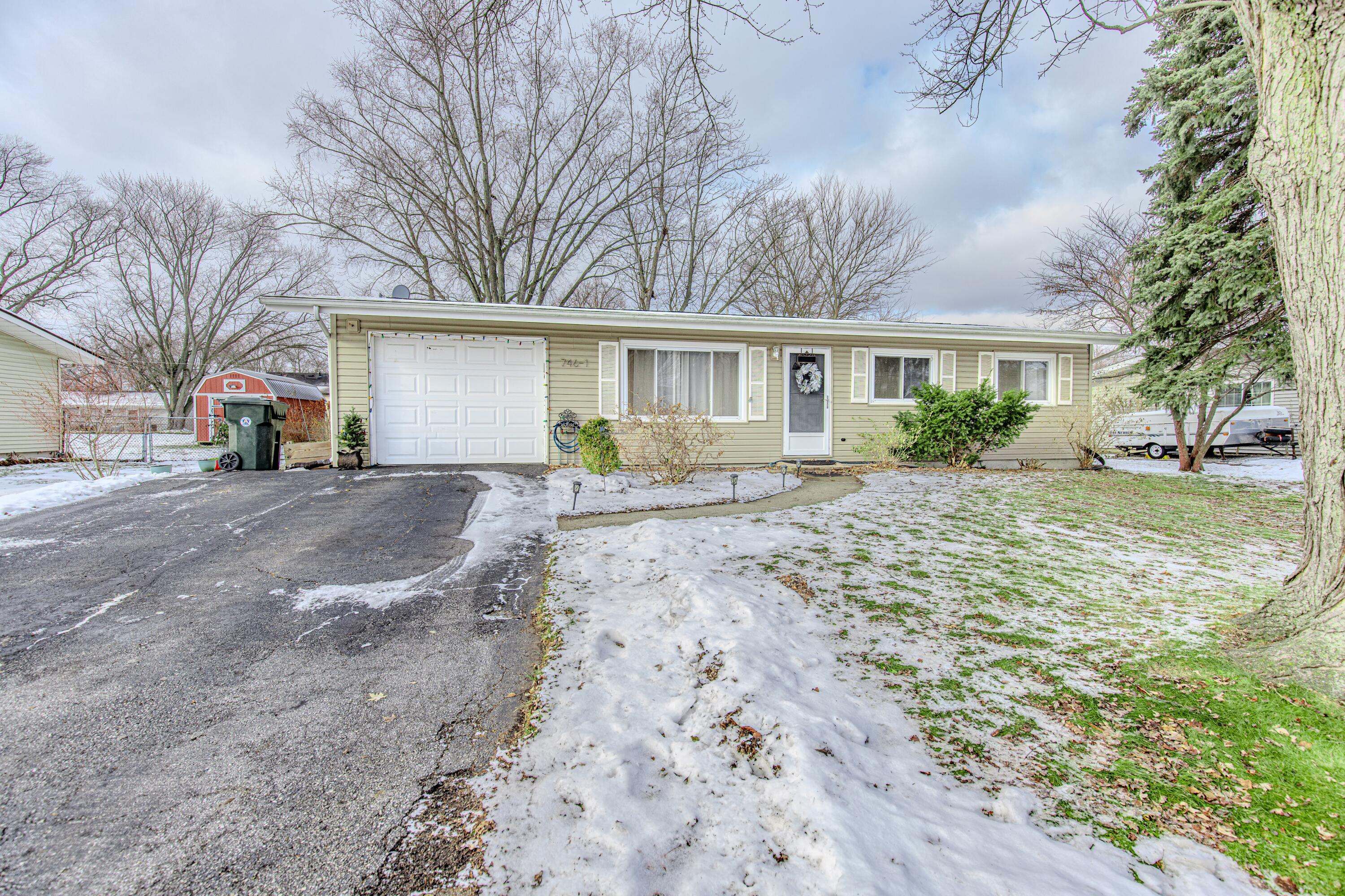 746-1 Acadia Road Valparaiso, IN 46385 - Photo 3 of 44 a front view of house with yard and trees around