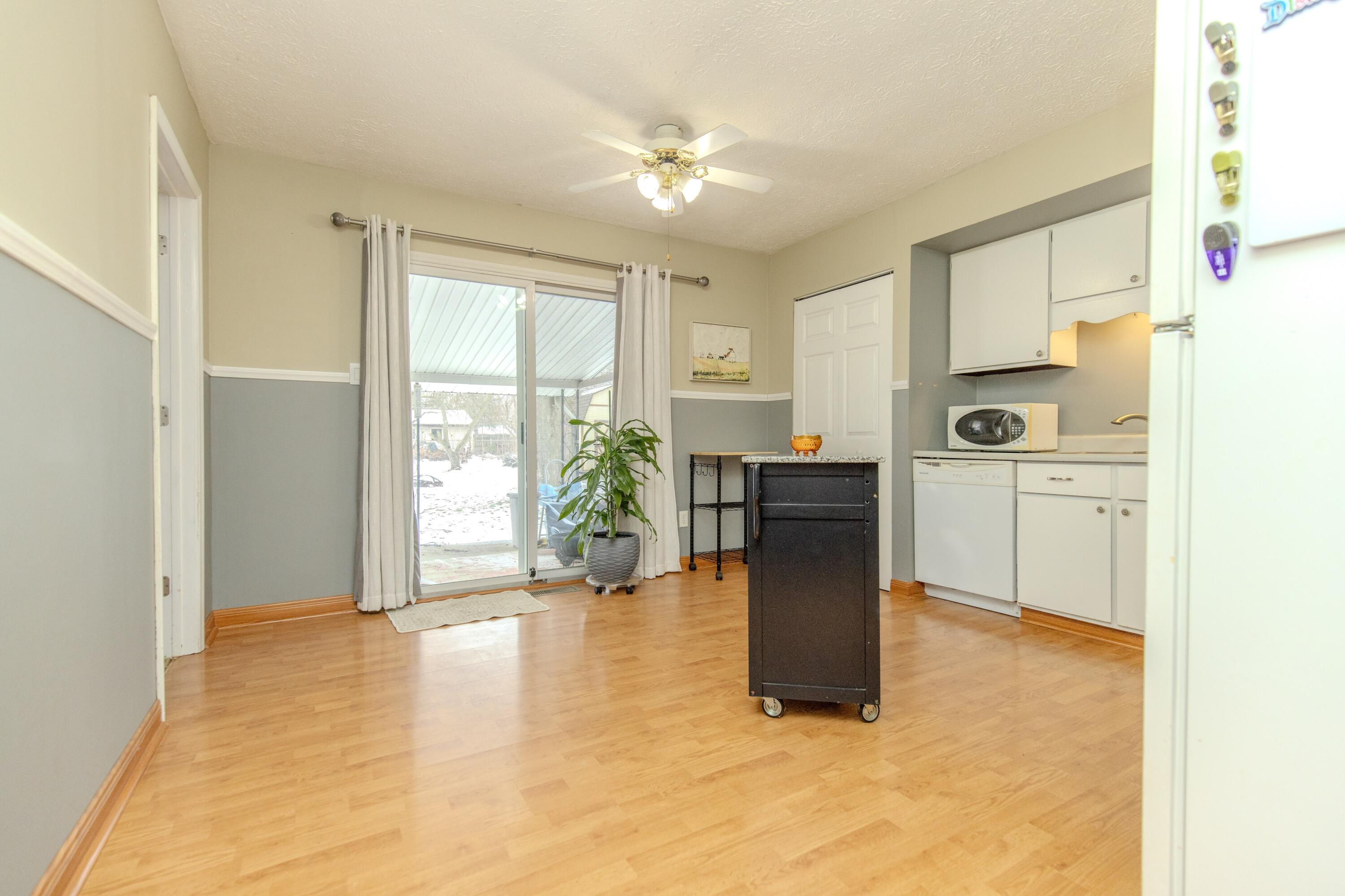 746-1 Acadia Road Valparaiso, IN 46385 - Photo 33 of 44 a view of a kitchen with furniture and a ceiling fan