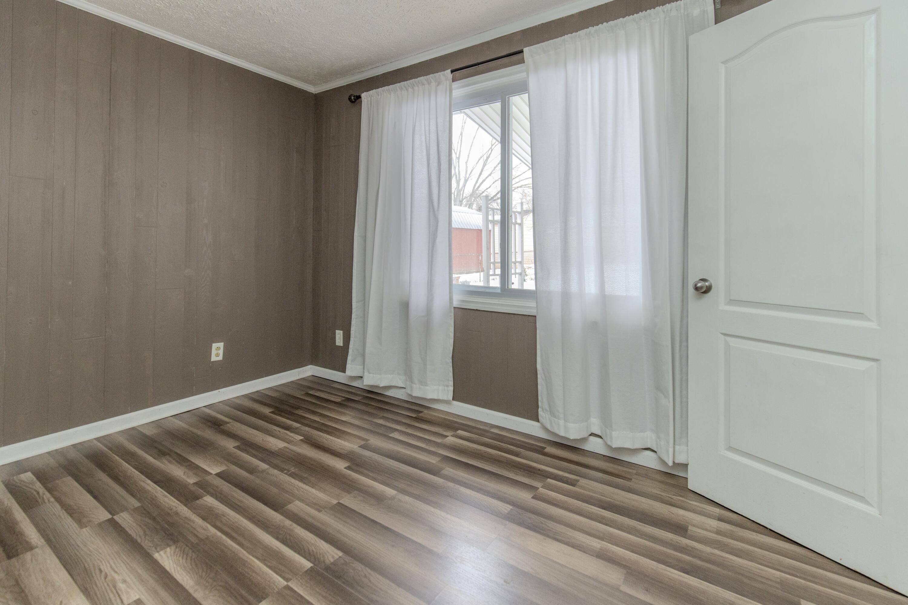 746-1 Acadia Road Valparaiso, IN 46385 - Photo 37 of 44 a view of a room with wooden floor and windows