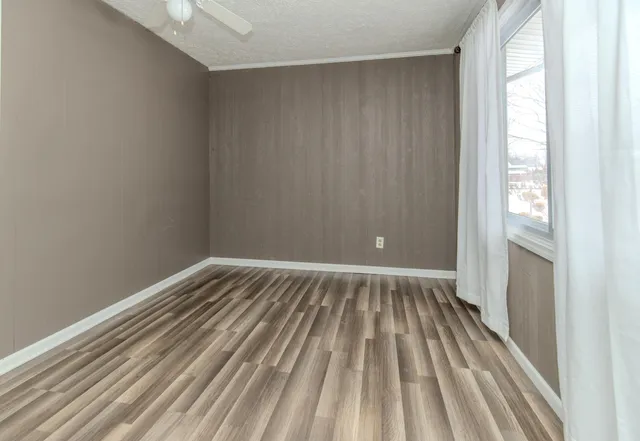 a kitchen with a sink a stove and cabinets