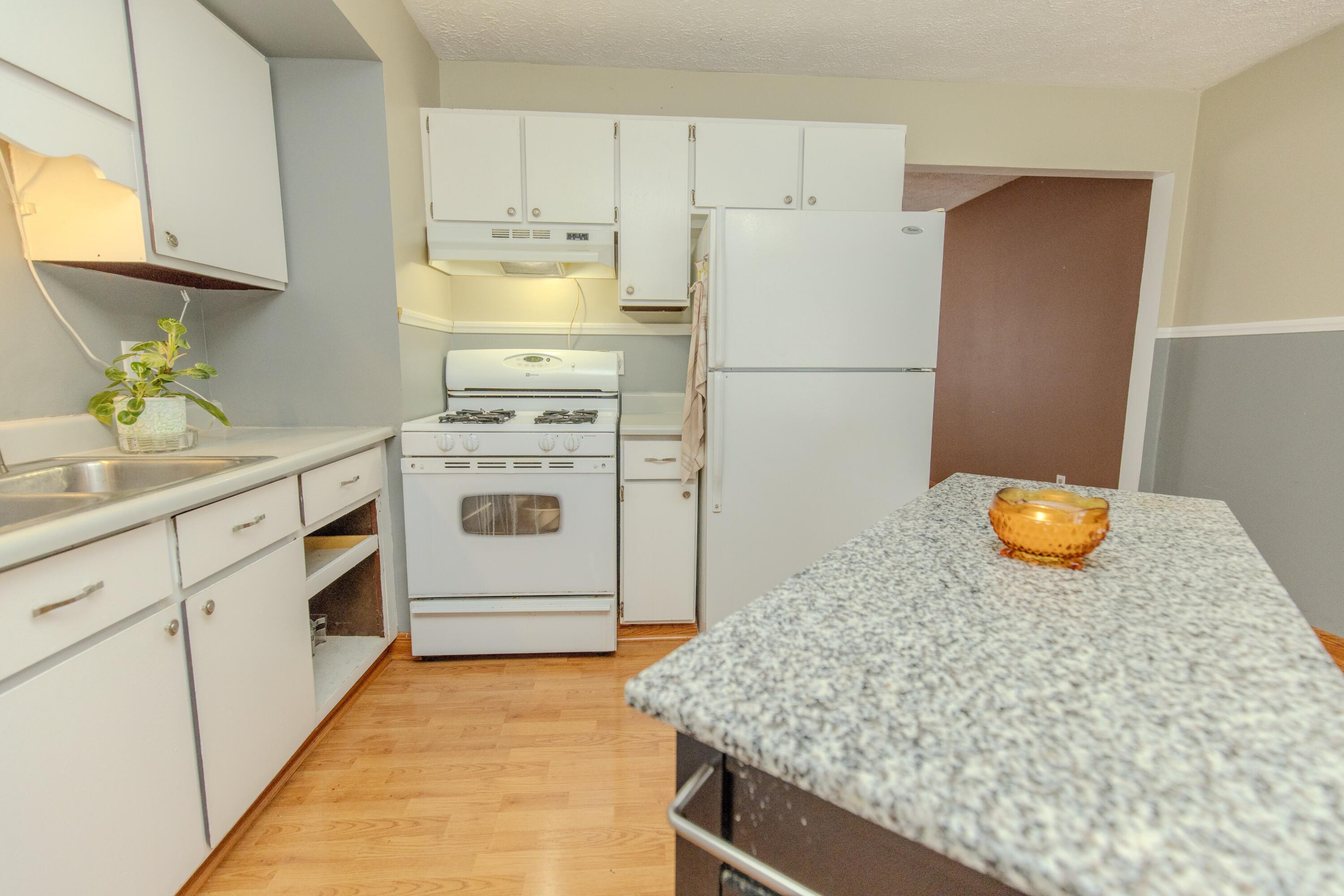 746-1 Acadia Road Valparaiso, IN 46385 - Photo 41 of 44 a kitchen with stainless steel appliances granite countertop a refrigerator a stove and a sink