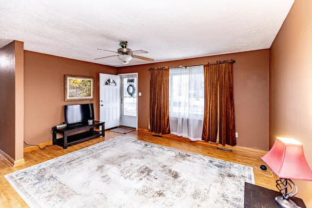 a bedroom with furniture and window