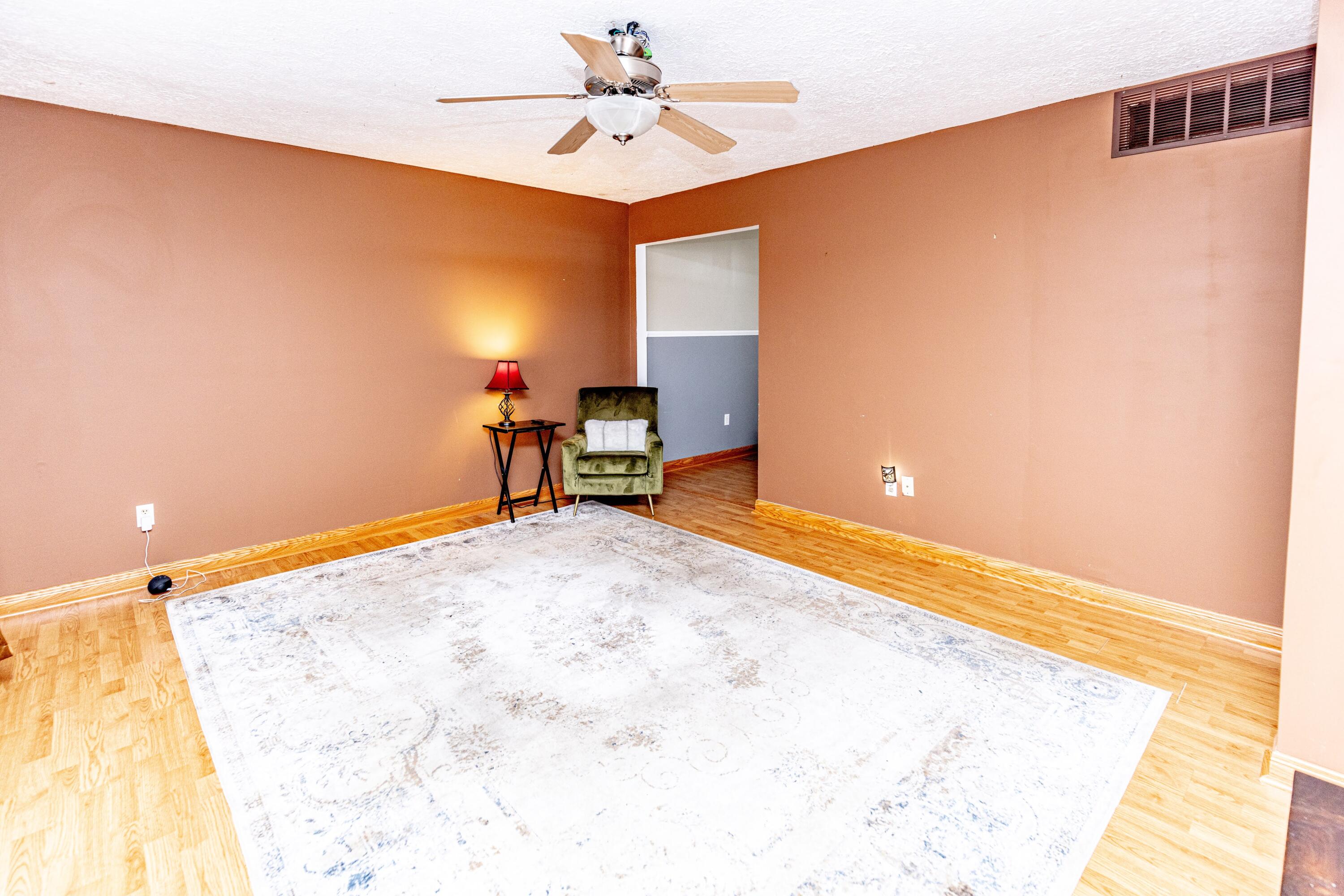 746-1 Acadia Road Valparaiso, IN 46385 - Photo 9 of 44 a view of a livingroom with furniture and a ceiling fan