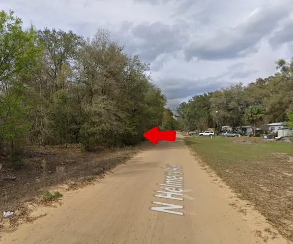 a view of a road with houses