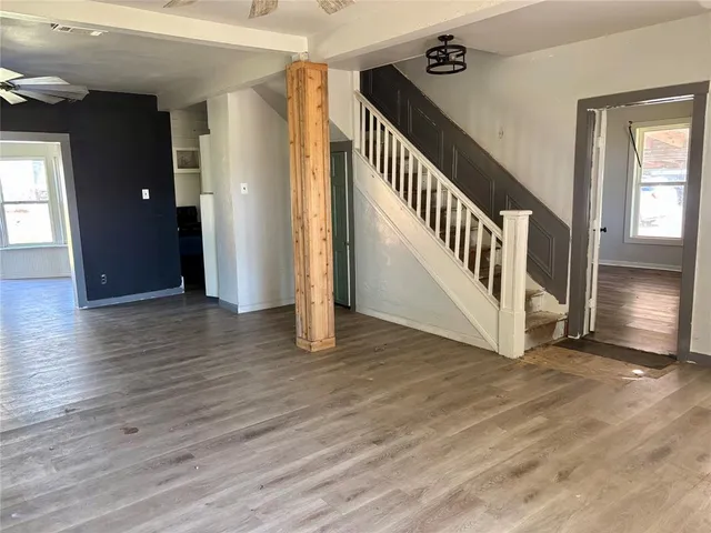 a view of an entryway with wooden floor