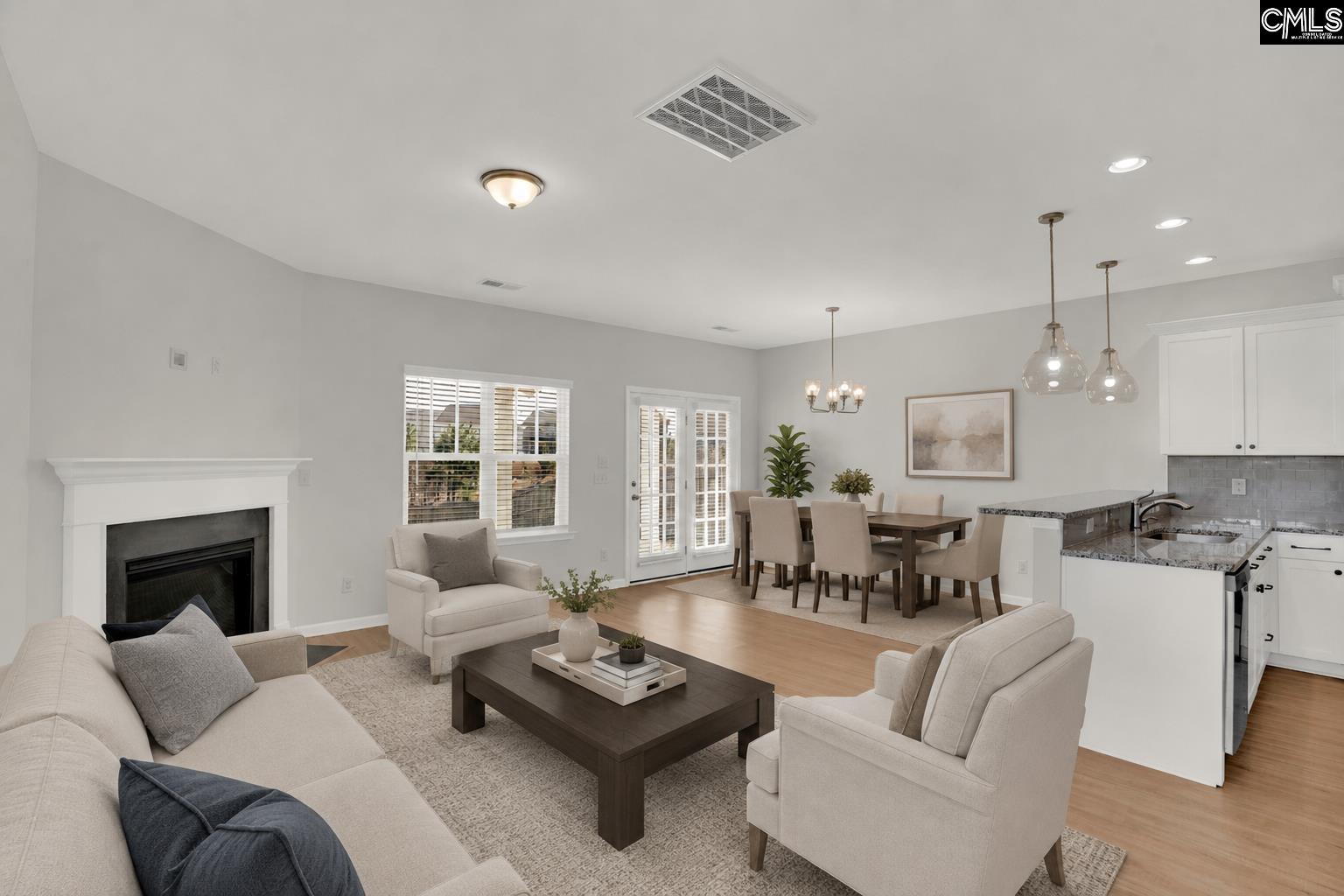 748 North Pinewalk Way Elgin, SC 29045 - Photo 5 of 25 a living room with furniture fireplace and a large window