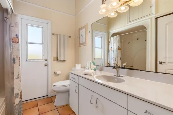 a view of a house with a tree