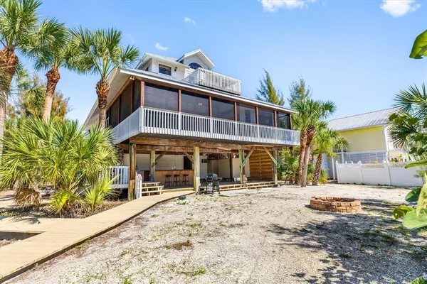 an aerial view of residential houses with outdoor space and swimming pool