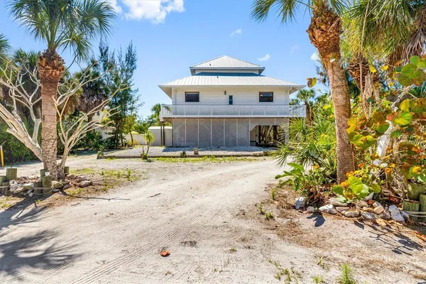 an aerial view of residential houses with city view